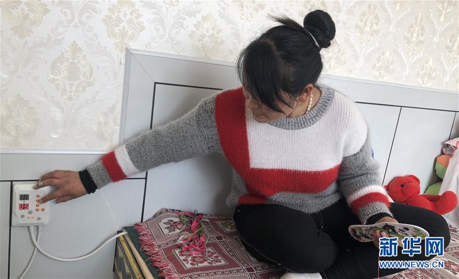 (新春走基層·圖文互動)(2)班彥村“冬天最幸福的事”:用上“電熱炕” 告別煤煙味